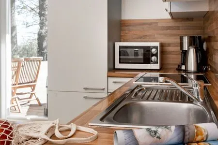 Küche / Küchenzeile FeWo Strandfrieden - Kamin, Sauna, Meerblick