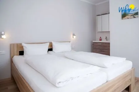 Schlafzimmer Apartmenthaus Roberta Ferienwohnung Seehund
