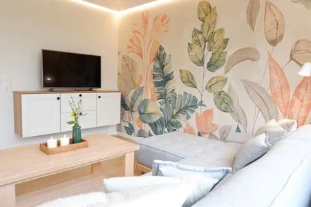 Wohnbereich mit Smart-TV im Wintergarten Ferienhaus Landliv Huus
