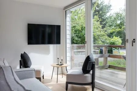 Wohnzimmer Haffperle Küstenglanz - zentral in Haffkrug, nur wenige Schritte zum Strand