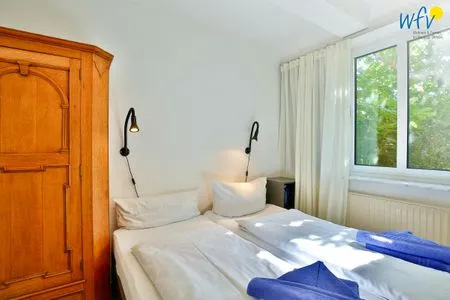 Schlafzimmer Haus Dünenblick Ferienwohnung 1