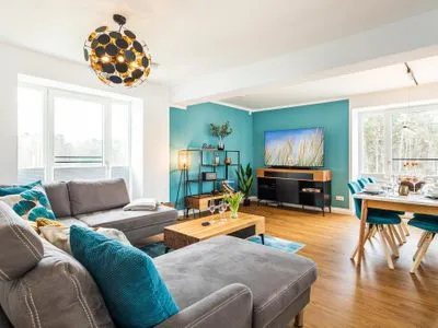 Wohnzimmer: Schlafsofa, TV FeWo Baltic Sunset in PRORA - 3.34