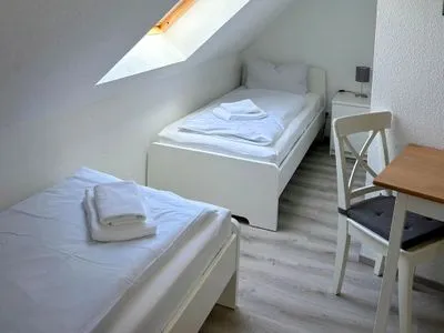 Schlafzimmer mit zwei Einzelbetten Am Deich Am Deich Haus 18
