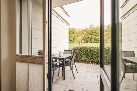 Wohnbereich mit Blick zur Terrasse Logierhaus Friedrich WE 2 - "Strandrose"