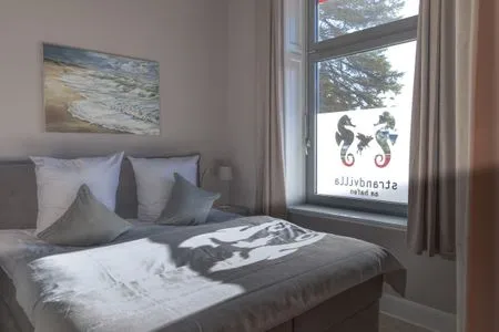 Schlafzimmer Strandvilla Hafenloge - stilvoll wohnen direkt am Niendorfer Hafen