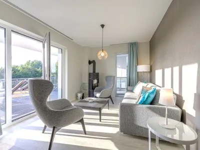 Ferienwohnung Strandblick Ostseebad Wustrow ZweiWasser Alte Seefahrtschule Wohnzimmer mit Kamin  Strandblick