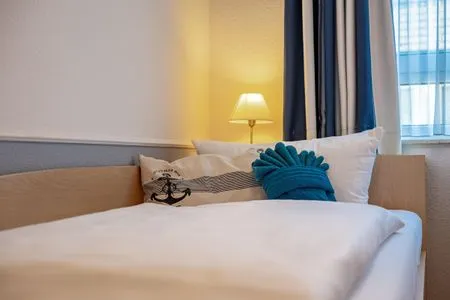 Schlafzimmer mit zwei Einzelbetten Residenz am Strand Wohnung 4-61