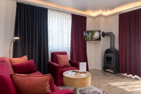 Wohnzimmer Villa Nause, Ferienwohnung Buchenfreund mit Spa und Freizeit