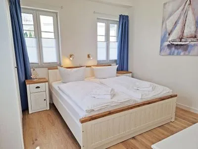 Schlafzimmer Villa Küstenperle, App. Sonnenaufgang - Meerblick pur!