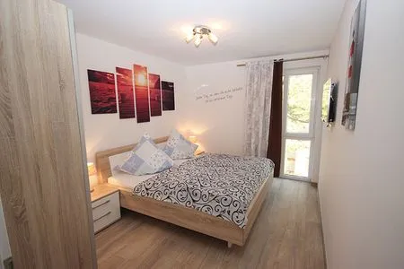 Schlafzimmer Villa Amelie, App. Seemöwe - mit Balkon und Meerblick