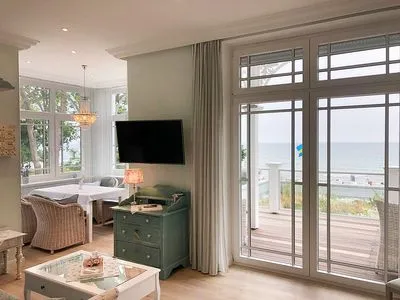 Wohnzimmer Villa Svanen App. 1 - exklusive Ferienwohnung mit Panorama-Meerblick - Deine Ferien am Meer