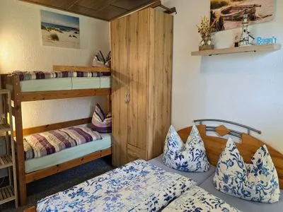 Bett Ferienhaus am Wiesengrund auf Rügen- familienfreundlich mit Terrasse und Grill