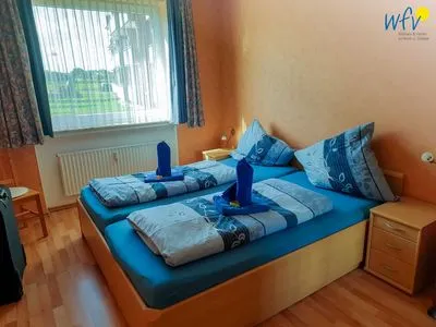 Schlafzimmer Holiday Residenz I Ferienwohnung Inselheimat B42