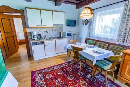 Kitchen and dining area Soldanella 2 by Alpenidyll Apartments
