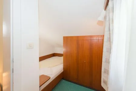 Schlafzimmer 2, Einzelbett City Life 4 by Alpenidyll Apartments