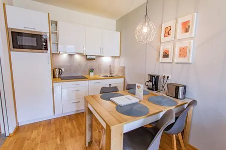 Kitchen with dining area Sunny Aich by Alpenidyll Apartments