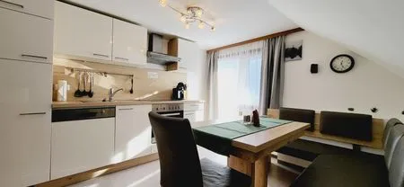 Kitchen island and dining area Fischbacher App. 3 by Alpenidyll Apartments