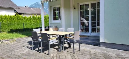 Außenanlage mit Sitzbereich Ferienhaus Aich by Alpenidyll Apartments