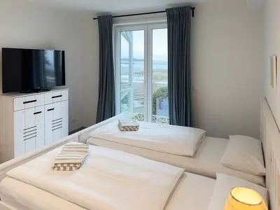 Schlafzimmer Haus *Weiße Düne* Ferienwohnung Weiße Düne 4