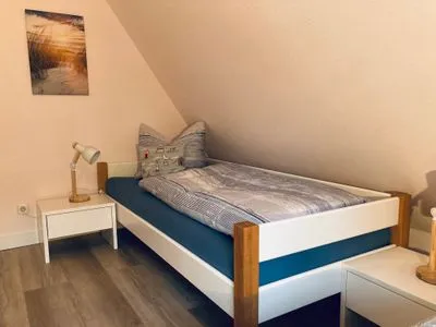 Schlafzimmer mit Einzelbetten Achtern Diek Achtern Diek 12b - Wohnung 5