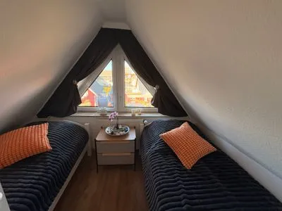 Schlafzimmer mit Einzelbetten  Ferienwohnung Seepferdchen