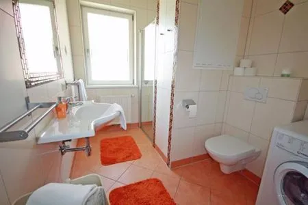 Badezimmer mit Waschmaschine Apart  15 by Alpenidyll Apartments