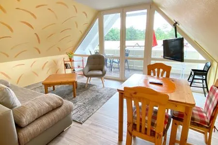 Wohnzimmer mit Zugang zum Balkon Hinter den Dünen - W87