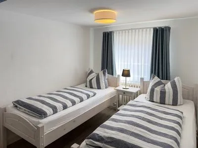 Schlafzimmer Haus Frisia Ferienwohnung Frisia 3