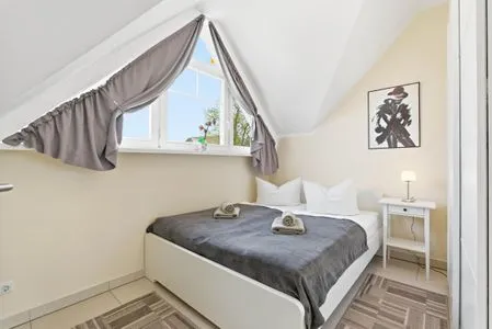 Schlafzimmer mit Doppelbett Hafenstrasse 15 in Prerow Wolke 7 in Prerow