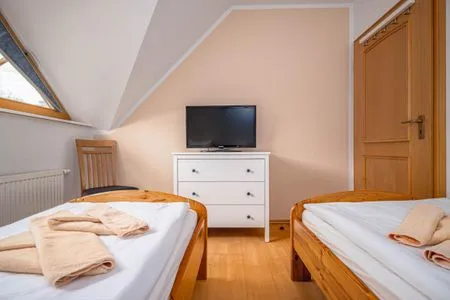 Schlafzimmer mit zwei Einzelbetten (OG) Ferienpark Freesenbruch Doppelhaushälfte 10a - Meeresbrise