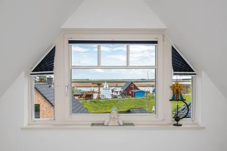 Blick aus dem Schlafzimmerfenster auf den Bodden Mühlenstrasse 23 - Wohnung Oberdeck