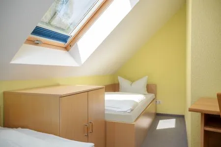 Schlafzimmer mit zwei Einzelbetten Am Deich Am Deich Haus 16 - Ostseewelle
