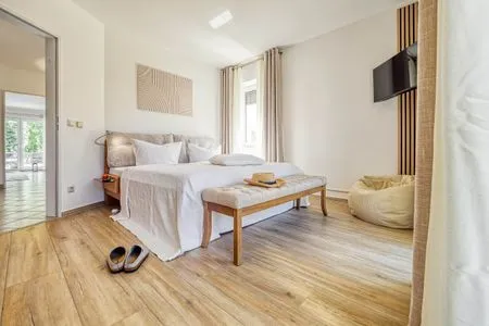 Schlafzimmer mit Doppelbett Parkresidenz am Hafen Wohnung HF 14 - "Sandburg Zingst"