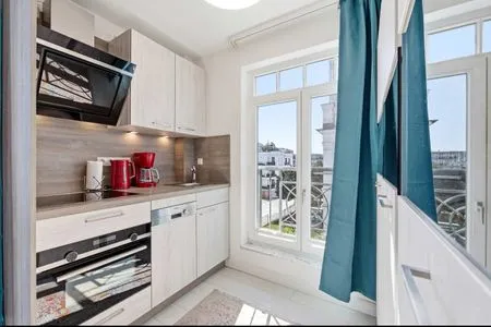 Küche / Küchenzeile Ferienwohnung Küstenkind direkt am Strand, modern eingerichtet mit Meerblick