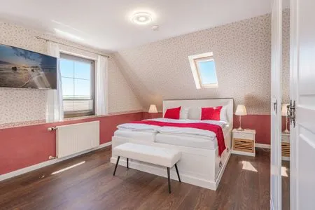 Schlafzimmer Ferienhaus Sonnendeck mit Sauna, Kamin & Terrasse für 12 Personen