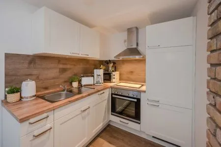 Küche / Küchenzeile Ferienwohnung Mittschiffs mit Sauna, Whirpool & Garten - nur 500 Meter zum Meer