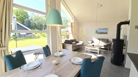 Wohnzimmer Ferienhaus "Kiek Ut" im Ferienpark Holm an der Ostsee