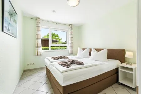 Schlafzimmer mit Doppelbett Residenz am Strand Wohnung 6-74