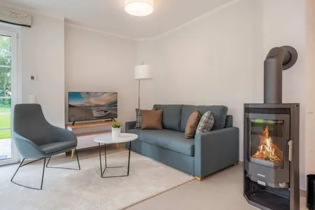 Wohnzimmer Ferienhaus Haff-Traum mit Kamin, Sauna und Terrasse