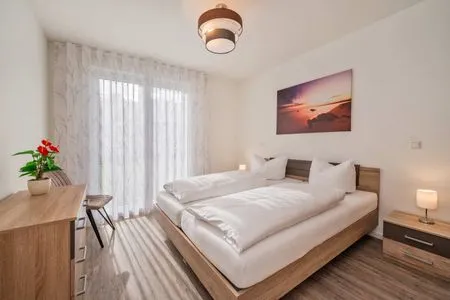 Schlafzimmer Ferienwohnung Klippenblick mit Sauna, Kinderspielbereich und Fitnessraum