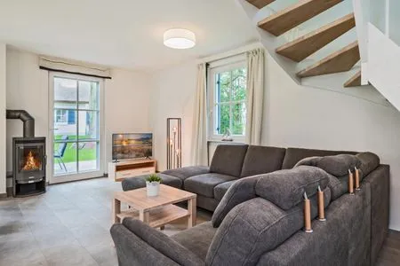 Wohnzimmer Ferienhaus Seeadler mit Kamin, Sauna und Terrasse