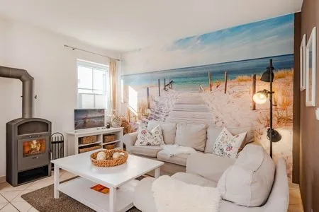 Wohnzimmer Ferienhaus Golfblick mit Sonnenterrasse und Kamin