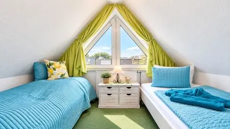Schlafzimmer mit zwei Einzelbetten  Ferienwohnung Jonathan