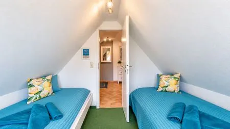 Schlafzimmer mit zwei Einzelbetten  Ferienwohnung Jonathan