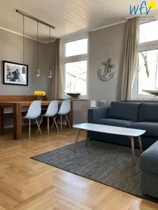Wohnzimmer / Essbereich Haus Inselrose Ferienwohnung Ankerrose