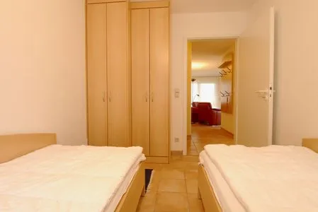 Schlafzimmer mit zwei Einzelbetten Residenz am Strand Wohnung 4-58