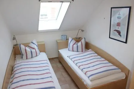 Schlafzimmer mit Einzelbetten Residenz am Strand Wohnung 4-64