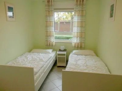 Schlafzimmer mit Einzelbetten Residenz am Strand Wohnung 6-74