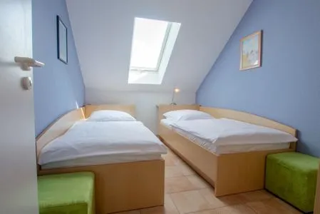 Schlafzimmer mit zwei Einzelbetten Residenz am Strand Wohnung 6-82