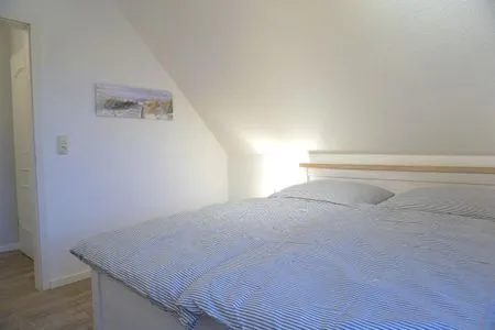 Schlafzimmer mit Doppelbett Zur Hanse Wohnung 1.4